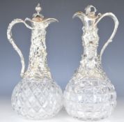 Two Victorian silver plated and cut glass claret jugs with vine decoration, height 30cm