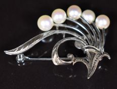 A silver Mikimoto brooch set with cultured pearls, 3.5cm