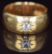 An 18ct gold ring set with an old cut diamond of approximately 0.2ct in a star setting, London 1917,