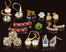 Four pairs of 9ct gold earrings including tanzanite, emeralds, and diamonds, four single earrings (