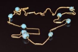 An 18ct gold necklace set with Venetian glass beads, 78cm long, 23g