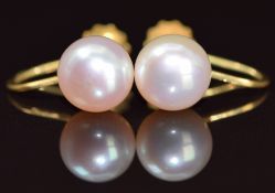 A pair of 18ct gold earrings set with pearls, 2.8g