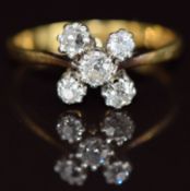An 18k gold ring set with five old cut diamonds, 2.9g, size P