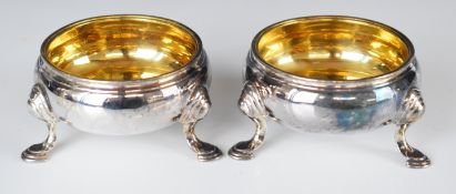 Pair of Georgian hallmarked silver hoof footed open salts with gilt interiors, marks rubbed but