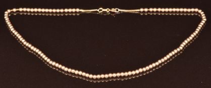 A 9ct gold necklace made up of round beads, 7.3g, 37cm
