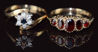 A 9ct gold ring set with five garnets and a 9ct gold ring set with a sapphire surrounded by