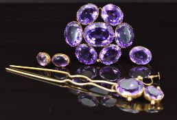 Two Victorian brooches set with amethysts, the largest approximately 22.9 x 18.1 x 10mm, Victorian