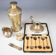 Hallmarked silver items comprising capstan inkwell, cased set of coffee bean spoons, novelty feature
