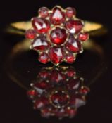 A c1900 18ct gold ring set with Bohemian cut garnets, 2.4g, size O