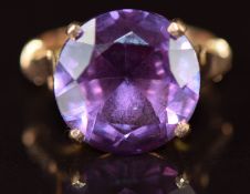 A 9ct rose gold ring set with a synthetic purple/ blue sapphire, 3.8g, size I
