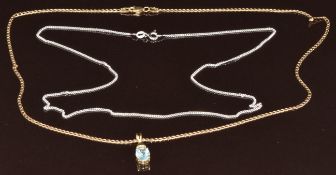 A 9ct gold pendant set with an oval cut topaz and diamonds on 9ct gold chain (3.6g, 45cm) and a
