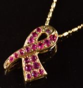 An 18ct gold pendant set with synthetic rubies (1.8cm) on 18ct gold chain, 4.8g, 50cm