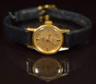 Omega 18ct gold ladies wristwatch ref. 511.314 with black hands and baton hour markers, gold dial