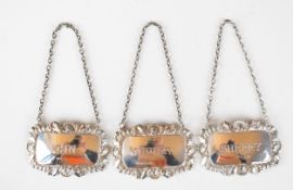 Three hallmarked silver bottle tickets or labels comprising Gin, Sherry and Whisky, various dates