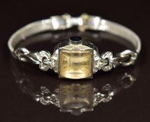 Wittnauer 14ct white gold ladies wristwatch with diamonds set to the bow shaped case lugs, silver