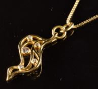 An 18ct gold pendant in a pierced wave design set with diamonds (2.5cm) on an 18ct gold chain, 4.7g,
