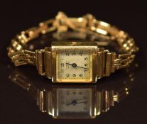 J W Benson 9ct gold ladies wristwatch with blued hands, Arabic numerals, silver dial and signed 15