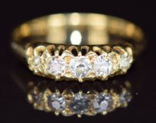 A c1900 18ct gold ring set with five old cut diamonds, 2.1g, size J