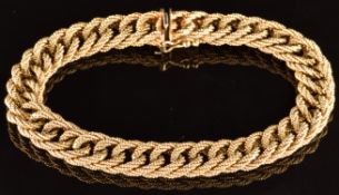 A 9ct gold bracelet with textured detail, 28.1g, 17cm