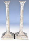 Pair of Georgian hallmarked silver Corinthian column candlesticks with stepped bases and gadrooned