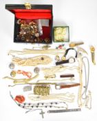 A collection of costume jewellery including coral necklace, faux pearls, Sarah Coventry brooch,
