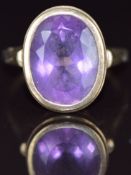 A 9ct gold ring set with an oval cut amethyst, 7g, size V