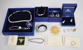 A collection of Swarovski jewellery including three necklaces, a bangle, bracelet, three pairs of