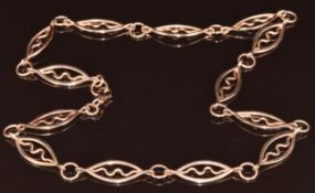 A 9ct rose gold necklace made up of marquise shaped links with a wave design in the centre, 16.1g,