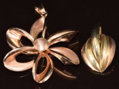 A 9ct rose gold pendant in the form of a stylised flower (4.5cm) and another 9ct gold pendant (2.