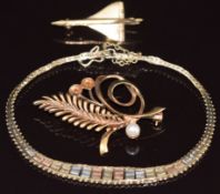 A 9ct gold tri-coloured bracelet, 9ct gold brooch set with cultured pearls and a 9ct gold brooch