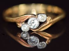 An 18ct gold ring set with old cut diamonds in platinum setting, 2.2g, size M