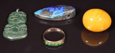 A 14k gold ring set with jadeite (1.4g, size J), a Maori tiki pendant, amber egg and opal boulder