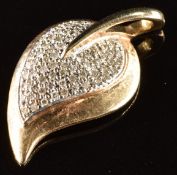 A 9ct gold pendant in the form of a leaf, set with diamonds, 3.3g, 2.6cm