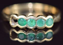 An 18ct gold ring set with emeralds (one stone missing), 2.4g, size N