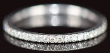 A platinum eternity ring set with diamonds, the total diamond weight approximately 0.25ct, 1.9g,