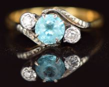 An 18ct gold ring set with a zircon and diamonds in a platinum twist setting, 3g, size N