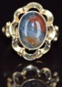 A 9ct gold ring set with moss agate cabochon, 3.2g, size N