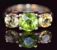 A 9ct gold ring set with three zircons, 3.2g, size K