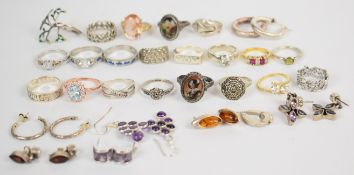 Twenty silver rings including marcasite, cubic zirconia, portraits, peridot, etc and seven pairs