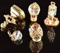 A 9ct gold seal set with lapis lazuli, 9ct gold pierced bead, 9ct gold charm in the form of a