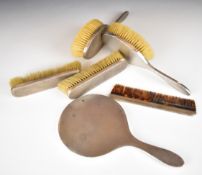 Art Deco hallmarked silver dressing table set comprising hand mirror, four brushes and comb,