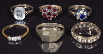 Five 9ct gold rings set with garnets, sapphires and paste (12.7g) and an 18ct gold ring set with