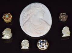 Three mother of pearl studs / buttons in the form of men, a cameo depicting a young woman, yellow