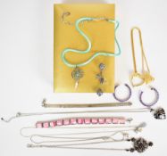 A collection of silver including necklace set with garnets and pearls, two bracelets, two pairs of
