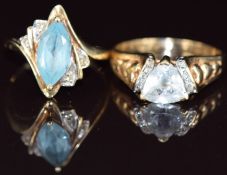 A 9ct gold ring set with a marquise cut topaz and diamonds and a yellow metal ring set with an