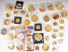A collection of military and aircraft related gold plated picture coins including oversized 70mm