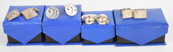 Four pairs of silver cufflinks comprising one pair set with black diamonds, one in the form of