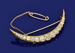 Late Victorian 18ct gold crescent brooch set with seventeen old cut graduated diamonds, the