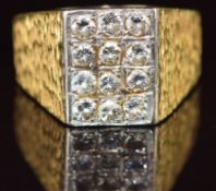 An 18ct gold ring set with twelve round cut diamonds, each approximately 0.12ct, 22.1g, size 1