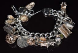 A silver charm bracelet with nineteen silver charms including hedgehog, Nuno flower opening to